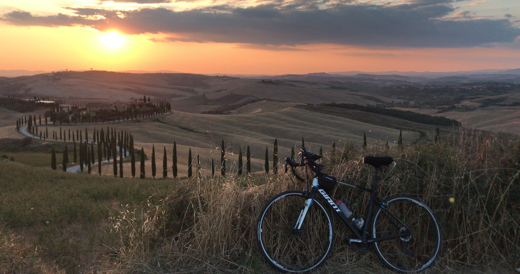 Flavia from Bucharest waiting sunset riding Siena hills