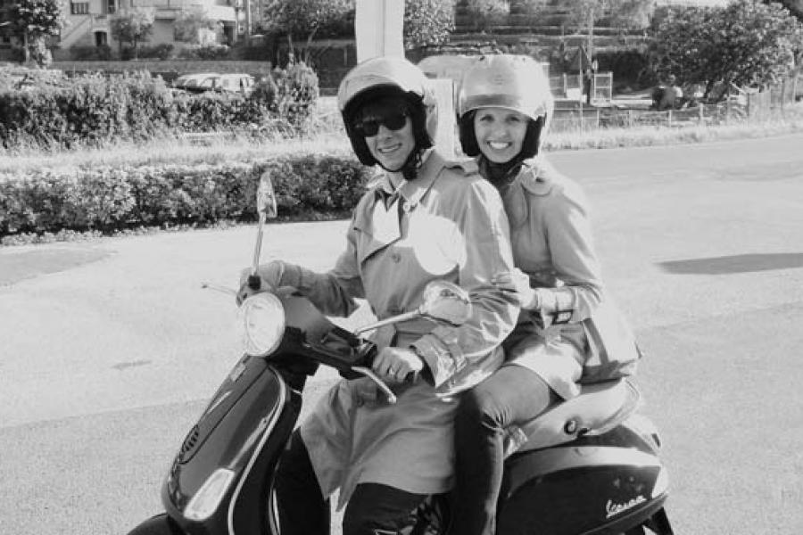 A young couple ready for a Vespa journey starting from Pisa